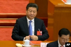 FILE - Chinese President Xi Jinping attends the closing session of the annual National People's Congress in Beijing's Great Hall of the People, March 16, 2016.