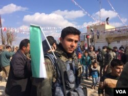Syrian soldiers and families rally in Soran, Syria on Feb. 1, 2018. (H.Murdock/VOA)