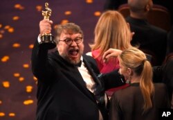 Guillermo del Toro, winner of the award for best director for "The Shape of Water" celebrates in the audience at the Oscars on Sunday, March 4, 2018, at the Dolby Theatre in Los Angeles. (Photo by Chris Pizzello/Invision/AP)
