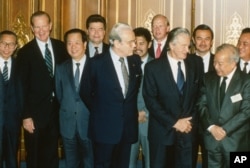 Foreign ministers attending the Paris Peace Conference on Cambodia pose prior to the meeting, Oct. 23, 1991. Front row L-R: United Nations Secretary General Javier Perez de Cuellar, Roland Dumas of France, Cambodia's Prince Norodom Sihanouk, back row L-R: unidentified, U.S. Secretary of State James Baker, Qian Qichen of China, Soviet Union's Boris Pankin, Burnei's Prince Mohamed Bolkiah, Great Britain's Lord Caithness, unidentified, Thailand's Anan Sarasin. (AP Photo)