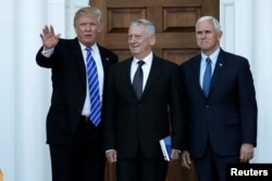 FILE - President-elect Donald Trump and Vice President-elect Mike Pence greet retired Marine General James Mattis for a meeting at the main clubhouse at Trump National Golf Club in Bedminster, New Jersey, November 19, 2016.