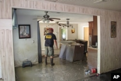 Dwight Chandler walks through his devastated home in Highlands, Texas, Aug. 31, 2017. Chandler, 62, said he worried that Harvey's floodwaters had washed in pollution from a U.S. EPA Superfund site a couple blocks from his home. The Highlands Acid Pit site near Chandler's home was filled in the 1950s with toxic sludge and sulfuric acid from oil and gas operations.