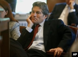 Larry Ottaway, one of the attorneys for Johnson & Johnson, listens during the state's opening arguments, May 28, 2019, in Norman, Oklahoma.
