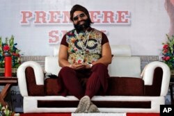 FILE - An Indian spiritual guru, who calls himself Saint Dr. Gurmeet Ram Rahim Singh Ji Insan, attends the premiere of the movie 'Jattu Engineer' in New Delhi, India, May 17, 2017.