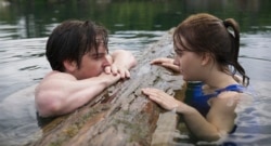 This image released by Apple TV+ shows Ferdia Walsh-Peelo, left, and Emilia Jones in a scene from "CODA." (Apple TV+ via AP)