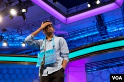 Shourav Dasari, 13, of Spring, Texas pauses during the morning round of the finals of the 2016 National Spelling Bee, in National Harbor, Md., Thursday, May 26, 2016. (AP Photo/Jacquelyn Martin)
