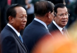 FILE - Cambodia's Prime Minister Hun Sen and top ruling party leaders gathered as they attended the annual Water Festival on the Tonle Sap river in Phnom Penh, Cambodia, November 10, 2019.