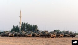 Turkish tanks stationed near the Syrian border, in Karkamis, Turkey, Aug. 27, 2016.