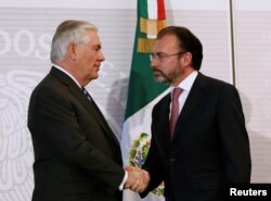 FILE - U.S. Secretary of State Rex Tillerson, left, and Mexico's Foreign Minister Luis Videgaray shake hands after a joint news conference at the Foreign Ministry in Mexico City, Feb. 23, 2017.