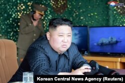 North Korea's leader Kim Jong Un supervises a "strike drill" for multiple launchers and tactical guided weapon into the East Sea during a military drill, May 4, 2019