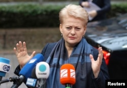FILE - Lithuania’s President Dalia Grybauskaite tweeted a concise reaction to Britain’s vote: “Brexit: respect, regret, re-engage.”