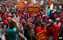 FILE - Opposition political parties gather on the lawns of the Government Union Buildings in Pretoria, April 12, 2017.