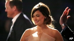 Kacey Musgraves, winner of the best country song award for "Merry Go 'Round", walks on stage at the pre-telecast of the 56th annual GRAMMY Awards on Jan. 26, 2014, in Los Angeles.