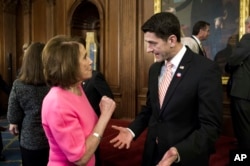 FILE - House Speaker Paul Ryan, R-Wis., talks with House Minority Leader Nancy Pelosi, D-Calif., on Capitol Hill in Washington, Dec. 8, 2016.