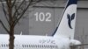 FILE - An Airbus with the description "The Airline of the Islamic Republic of Iran" is parked at the Airbus facility in Hamburg Finkenwerder, Dec. 19, 2016. Iran 's aviation body announced Sunday the cancelation of flights at some of the country's airports. 