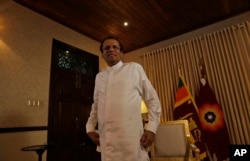 Sri Lankan President Maithripala Sirisena smiles as he leaves after an interview with the Associated Press at his residence in Colombo, Sri Lanka, Tuesday, May 7, 2019.