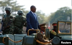 FILE - Burundi’s President Pierre Nkurunziza arrives for an independence day celebration in Bujumbura, July 1, 2017.