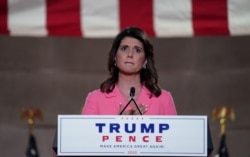 Former U.S. Ambassador to the United Nations Nikki Haley puts her hand over her heart as she speaks to the largely virtual 2020 Republican National Convention in a live address from Washington, U.S., August 24, 2020. REUTERS/Kevin Lamarque