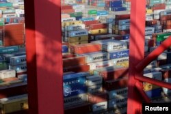 FILE - Containers are seen at the Yangshan Deep Water Port, part of the Shanghai Free Trade Zone, in Shanghai, China, Sept. 24, 2016.