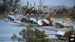 Damaged sail boats are shown in the aftermath of Hurricane Irma, Sept. 11, 2017, in the Florida Keys.