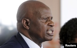 FILE - Zimbabwe's Finance Minister Patrick Chinamasa says that "there is need for a change of attitude by our banks to reflect our economic realities."