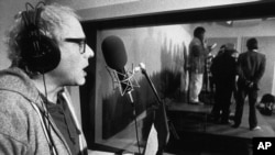 In this Nov. 20, 1987 file photo, then-Burlington, Vt. Mayor Bernie Sanders sings during a recording session in Burlington, Vt.