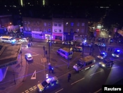 Police officers attend to the scene after a vehicle collided with pedestrians in the Finsbury Park neighborhood of North London, Britain June 19, 2017. MANDATORY CREDIT Thomas Van Hulle/Social Media via REUTERS ATTENTION EDITORS - THIS IMAGE HAS BEEN SUP