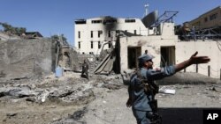 Afghan security forces inspect the site of an attack in Kabul, Afghanistan, Sept. 6, 2016. The country has seen unprecedented levels of civilian casualties this year due to an intensified Taliban insurgency.