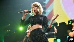 Taylor Swift performs at KIIS FM's Jingle Ball at the Staples Center on Dec. 5, 2014, in Los Angeles.