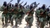 FILE - Al-Shabab fighters march during drills near Mogadishu, Somalia, Feb. 17, 2011. The U.S. military has carried out three airstrikes against al-Shabab in Somalia in less than a week, the latest on March 13, 2019.