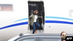 FILE - U.S. Democratic vice presidential candidate and Senator Kamala Harris gets off a plane as she arrives at Fresno Yosemite International Airport in Fresno, California, Sept. 15, 2020.