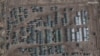 This handout satellite image released by Maxar Technologies and taken on November 1, 2021, shows the presence of a large ground forces deployment on the northern edge of the town of Yelnya, Smolensk Oblast, Russia. 
