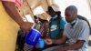 FILE - Cholera patients are rehydrated with salt and sugar solution at Kuwadzana Polyclinic in Harare, Zimbabwe, Nov. 24, 2023.
