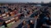 FILE - An aerial image shows cargo shipping containers at the Port of Los Angeles in San Pedro, California, Oct. 15, 2021.