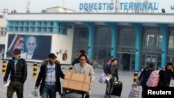 FILE - Afghans, whose asylum applications have been rejected, arrive from Germany in Kabul, Afghanistan, Dec. 15, 2016.
