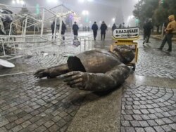 A monument to Nursultan Nazarbayev, demolished by protesters.