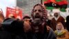 A man shouts during a demonstration against what the protesters said was the decision of the National Congress to extend the period of their stay in power, in Benghazi December 27, 2013.