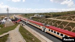 FILE - A general view shows a train on the Standard Gauge Railway line constructed by the China Road and Bridge Corporation and financed by Chinese government in Kenya, Oct. 16, 2019. 
