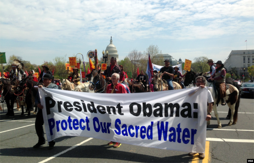 Native Americans, farmers, ranchers, and cowboys gather outside the Capitol Hill during a "Reject and Protect" rally to protest against the Keystone XL tar sands pipeline, Washington D.C., April 22, 2014. (Diaa Bekheet/VOA)