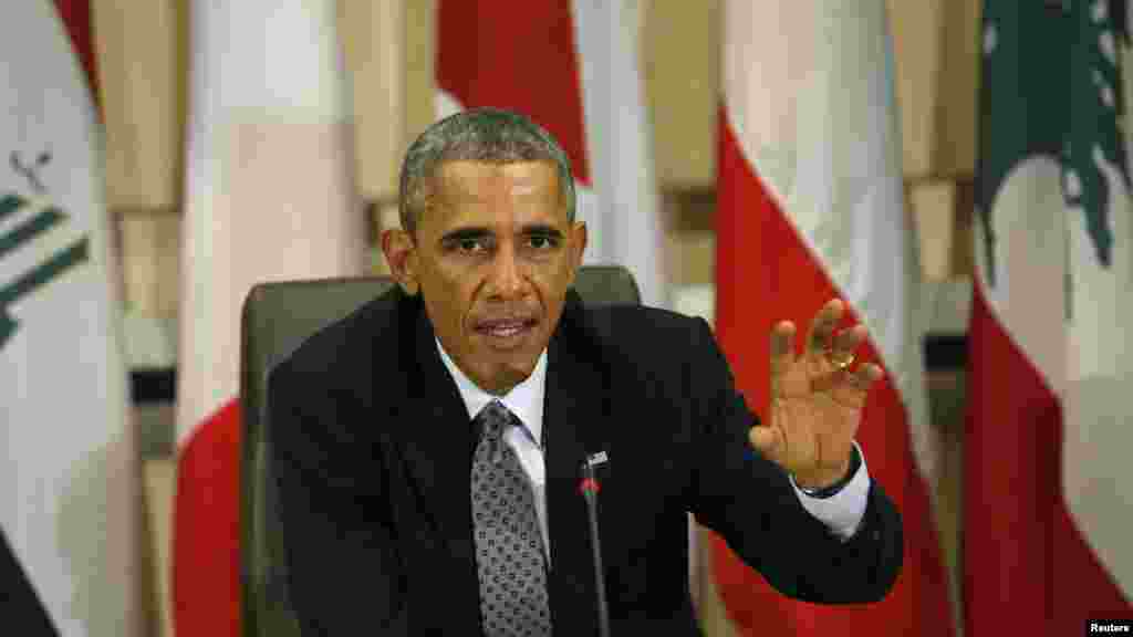 U.S. President Barack Obama speaks at a meeting with more than 20 foreign defense chiefs to discuss the coalition efforts in the ongoing campaign against Islamic State militants at Joint Base Andrews in Washington, Oct. 14, 2014. 
