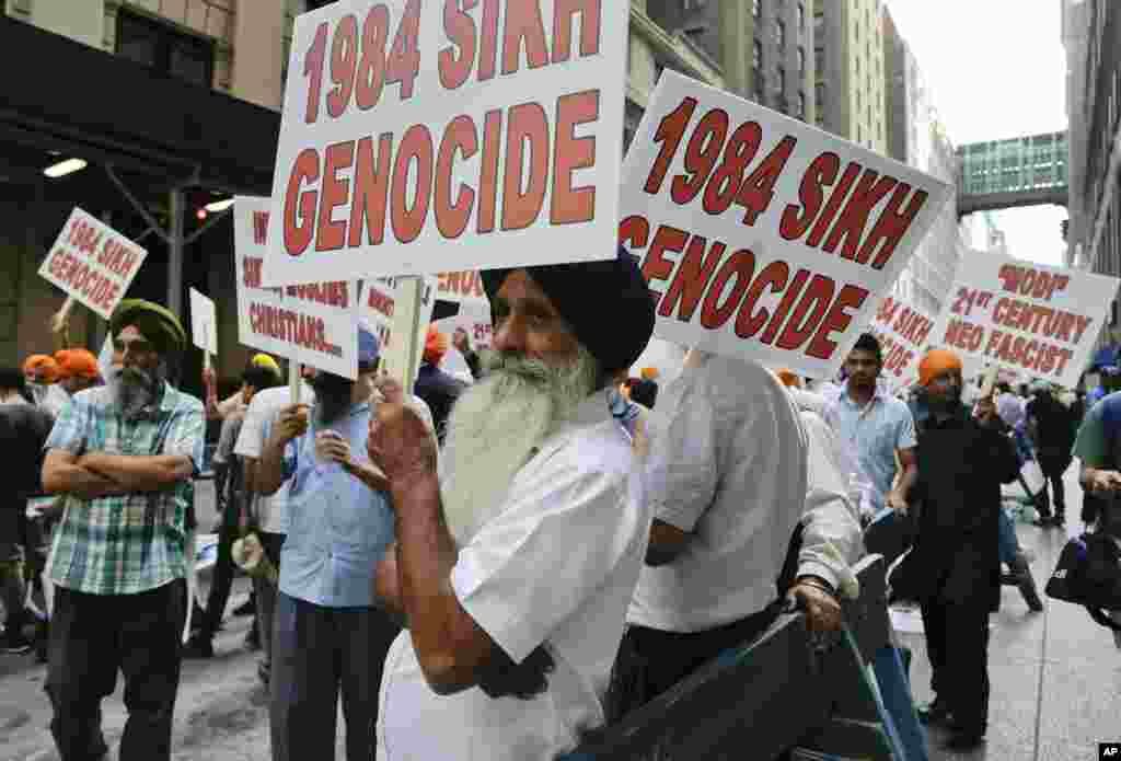 Protesters stage a demonstration against Indian Prime Minister Narendra Modi where he spoke to a capacity crowd from the Indian-American community, across the street from Madison Square Garden, New York, Sept. 28, 2014.