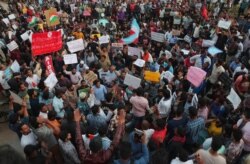 Indian students take part in a rally against a new citizenship law, at Osmania University campus, in Hyderabad, India, Dec.17, 2019.