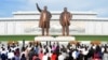 FILE - People visit the the statues of North Korea's founder Kim Il Sung and late leader Kim Jong Il on the 74th anniversary of North Korea's founding, in Pyongyang, North Korea in this photo released by North Korea's Korean Central News Agency (KCNA) Sept. 10, 2022. 
