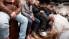 Pope Francis washes the feet of inmates during his visit to the Regina Coeli detention center in Rome, March 29, 2018. During his Holy Thursday visit, Francis stressed that a pope must serve society's marginalized and give them hope. 