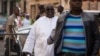 ARCHIVES - Papa Massata Diack, au centre, fils de l'ancien président de l'IAAF Lamine Diack arrive au commissariat central de Dakar, au Sénégal, lundi 17 février 2016. 
