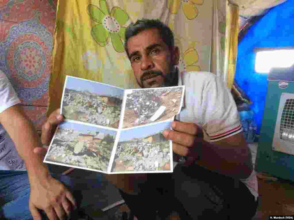 Wani dan gudun hijira mai suna Ibrahim Makhool na dauke da hotunan gidansa da hare-haren jarigen sama suka rusa a lokacin da ake kaiwa 'yan ta'addan IS hari a watan Disamba, harin da ya kashe biyu daga cikin yaransa uku a garin Hammam Alill dake Iraqi, ranar Laraba 21 ga watan Yuni shekarar 2017. 