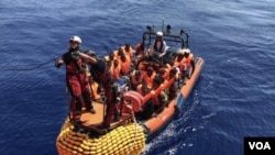 MIGRANTS AT SEA