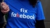 Facebook staff member looks at his computer after the opening ceremony of the company's new office in Hong Kong, July 24, 2014. 