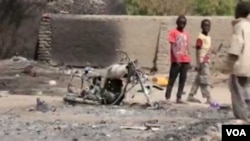 Scène de destruction après une attaque de Boko Haram.