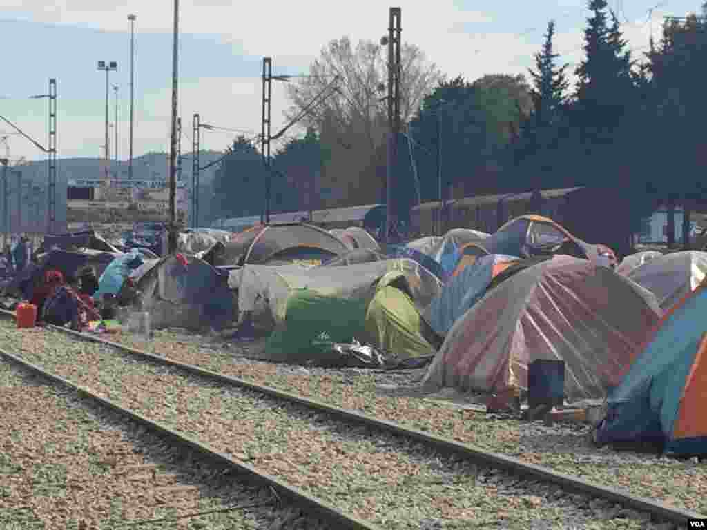 Besides staging sit-ins on train tracks, refugees set up tents to prevent trains from moving, in Idomeni, Greece, March 30, 2016. With no money or any political influence, refugees say it’s the only leverage they have. (Photo - H. Murdock/VOA)